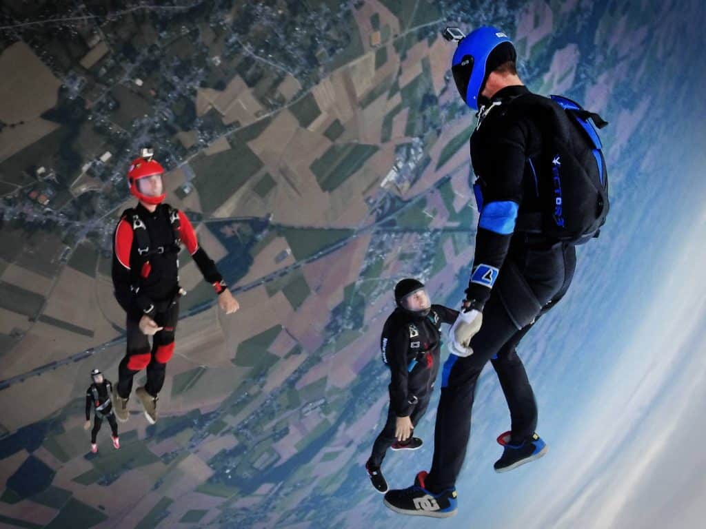 action camera - three people skydiving 