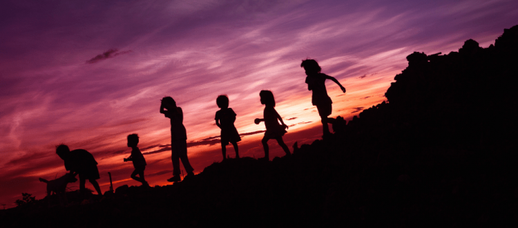 silhouette of children's running on hill